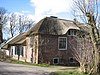 Boerderij, dwarshuis, rieten dak, zeer fraai klein geval. Achterbouw 18e eeuw