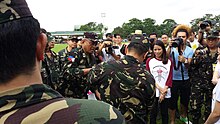 BGen Johnny Macanas AFP, AFP Deputy J-9, plants the first saplings together with members of the 105th TASG Command Section and representatives from the San Miguel Corporation.