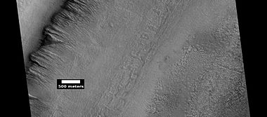 Gullies along mesa wall, as seen by HiRISE under HiWish program