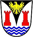 a pile embowed - Argent, on a pile embowed sable, between two towers gules and in base three barrulets wavy azure, an eagle displayed or - West Coast Peninsula Transitional Council, RSA