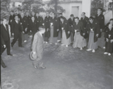 Emperor Shōwa greeted by officials and wrestlers in 1956.