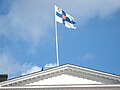 Il-banner presidenzjali Finlandiż fil-Palazz Presidenzjali ta' Ħelsinki.