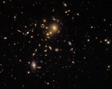 Galaxy cluster SDSS J0915+3826 helps astronomers to study star formation in galaxies. Helping Hubble SDSS J0915+3826.tif