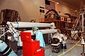 A worker assembles parts for the Japanese Experiment Module remote manipulator arm, under gold light