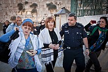 Women detained at Western Wall for wearing prayer shawls; photo from Women of the Wall Lesley and Rachel Detained.jpg