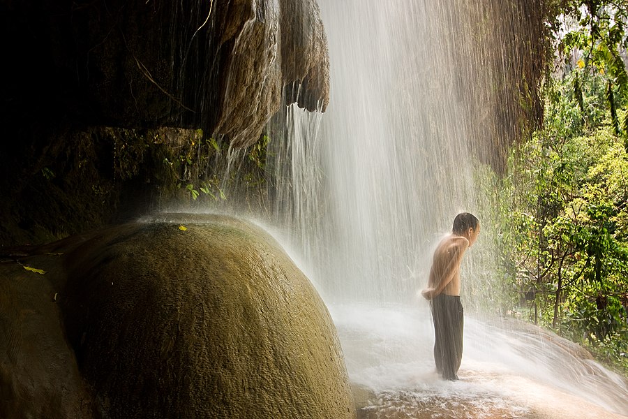 A boy in a waterfall at the park. This photo was a finalist for Commons Picture of the Year in 2017.