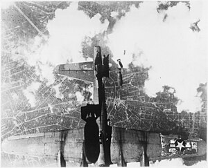 An American B-17 Flying Fortress "Miss Donna Mae II" is damaged by bombs after drifting under the American bomber flying above it during the bombing of Berlin in 1944. The damage to the horizontal stabilizer caused the plane to go into an uncontrollable spin and crash, killing all 11 crew members. United States bombing raid over a German city - NARA - 197269.jpg