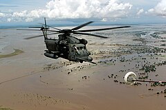 An MH-53M Pave Low IV helicopter approaches the refueling basket of an MC-130P Combat Shadow.jpg