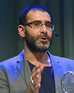 Behrang Kianzad i en debatt om flyktingmottagande och migrationspolitik på Kulturhuset Stadsteatern i Stockholm 2014.