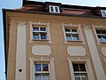 Facade detail with adorned pilasters