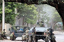 Mexican troops during a gun battle in Michoacan, 2007. Mexico's drug war claims nearly 50,000 lives each year. Fuerza del Estado Michoacan.jpg