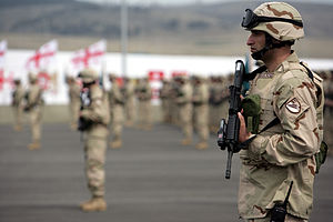 English: A Republic of Georgia soldiers stands...