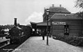 NS 717 with a train along the platform at Appingedam station. (1920 - 1933)