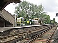 Westward view from under the footbridge, next to the level crossing.