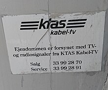 Old sign from the former regional telephone company, KTAS, indicating that the building is connected with TV- and radio signals from KTAS Old KTAS sign.jpg