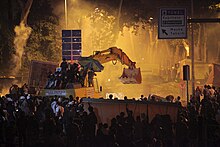 A bulldozer later nicknamed POMA was hijacked by Carsi members and used against police forces' TOMA vehicles. POMA Bulldozer Hijacked by Carsi at Gezi protests.jpg