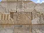 Faravahar, a symbol of Zoroastrianism in Persepolis Persepolis - carved Faravahar.JPG