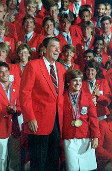 President Ronald Reagan and Mary Lou Retton with the U.S. Olympic Team in Los Angeles, 1984. Retton had just recovered in time from surgery to compete for the all-around title, where she completed two perfect 10s to defeat her Soviet-bloc competitor by .05 points for the gold medal. President Ronald Reagan with Mary Lou Retton and the 1984 United States Olympic team.jpg