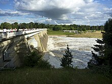 Scrivener Dam with three open fish belly floodgates, 2010 Scrivener Dam with 3 open sluices.jpg