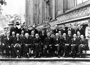 Fifth Conference, 1927. 1st row : Langmuir, Planck, Madame Curie, Lorentz, Einstein, Langevin, Guye, Wilson, Richardson. 2nd row : Debye, Knudsen, W. L. Bragg, Kramers, Dirac, Compton, de Broglie, Born, Bohr. 3rd row : Piccard, Henriot, Ehrenfest, Herzen, de Donder, Schrodinger, Verschaffelt, Pauli, Heisenberg, Fowler, Brillouin.