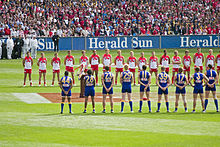 The West Coast Eagles and Sydney Swans line up for the national anthem at the 2005 AFL Grand Final. The teams line up for the national anthem, 2005 AFL Grand Final.jpg