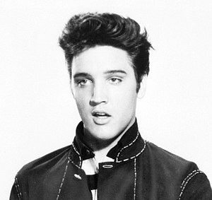 A cropped photograph depicts singer Elvis Pres...