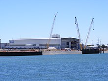 The ASC shipyard in Osborne, South Australia. The original intention was to build the new submarines at this government-owned shipyard, even if ASC was not the successful tenderer. Australian Submarine Corporation building.jpg