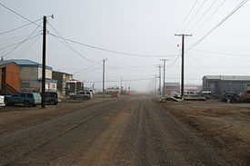 Street view of Barrow in July 2008. This street, like all the others in Barrow, has been left unpaved due to the prevalence of permafrost and the maintenance issues which would result were they to be paved.