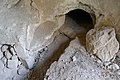 A small tunnel leading to an ancient burial chamber.