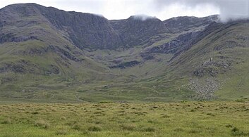 Looking into the corrie of Lug More (Irish: Coum Dubh), and the headwall of Ben Lugmore, with The Ramp running diagonally across the face.