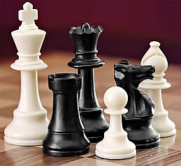 A photo of some chess pieces on a board