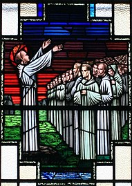 Saint Finnian of Clonard preaches to his monks at Clonard. (Stained glass, 1957).