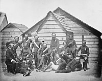 Crimean War, [Group of soldiers outside a hut], asi 1855