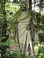 „Der Sensenmann“ mit Stundenglas. Grabplastik von August Schmiemann, Melaten-Friedhof, Köln, nach 1900.