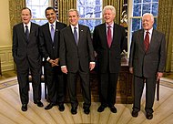 Five presidents in the oval office. The two more recent presidents, George Bush and Barack Obama, are wearing purple ties.