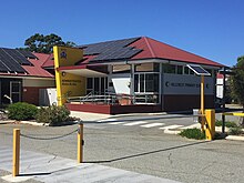 Photograph of the Hillcrest Primary School Administration extension with a red roof and solar panels