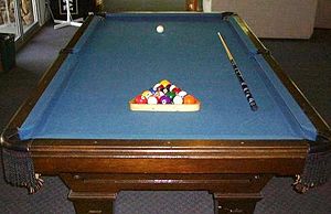 Pool table with equipment.