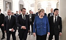 From left, Russian President Vladimir Putin, French President Emmanuel Macron, German Chancellor Angela Merkel and Ukrainian President Volodymyr Zelenskyy in Paris, France, December 2019 Putin, Macron, Merkel, Zelensky (2019-12-10) 01.jpg