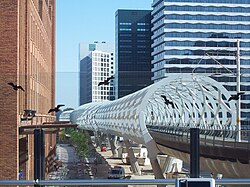 RandstadRail station Beatrixkwartier, nicknamed The 'Netkous' or Fishnet Stocking, with neighbouring skyscrapers