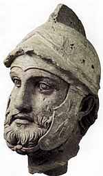 A sculpted head of a Parthian wearing a Hellenistic-style helmet, from Nisa, Turkmenistan, 2nd century BC Sarbaz Nysa.jpg