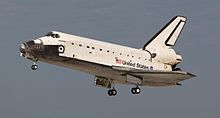 Space Shuttle orbiter, first crewed orbital spaceplane Space Shuttle Atlantis landing at KSC following STS-122 (crop).jpg