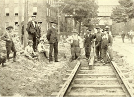 A plaque honoring Charles E. Duryea and the Duryea Motor Wagon Company of Springfield, first producer of an American gasoline automobile; Charles Pellissier and Holyoke Street Railway workers with a crucible prior to ignition, as the first mile of track in the United States is laid with thermite welding in 1904