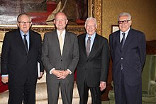 Carter, Ahtisaari, Hague, and Brahmdi standing next to each other.