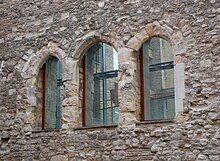 Doors formerly to the kitchens in the surviving west wall Windows on the West Wall of Winchester Palace.jpg