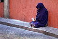 55 Woman beggar