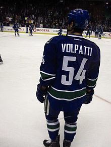 Photographie d'un joueur de hockey sur glace de dos