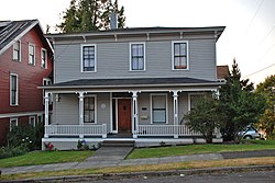 Photograph of the Stevens House, a two-story house on a residential city street