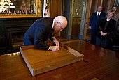 Vice-President Cheney signing the Theodore Roosevelt desk