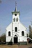 Schellingwouderkerk, zaalkerk met tongewelf en met houten geveltoren, interieur met preekstoel in Renaissance bouwstijl uit 1619