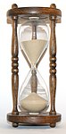 Ett timglas som mäter hur mycket tid som förflutit. Timglaset var en av de tidigaste tidmätarna
